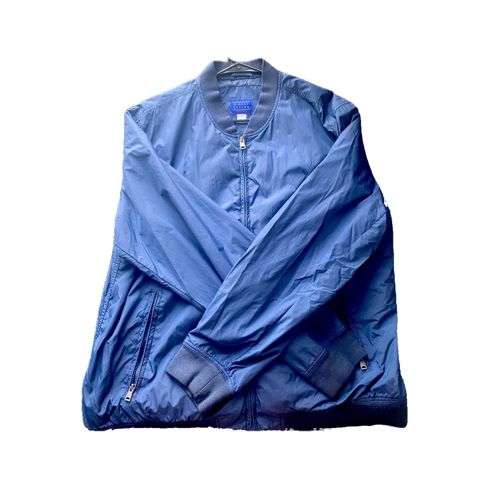 Blue light bomber jacket has a small discoloration spot on back